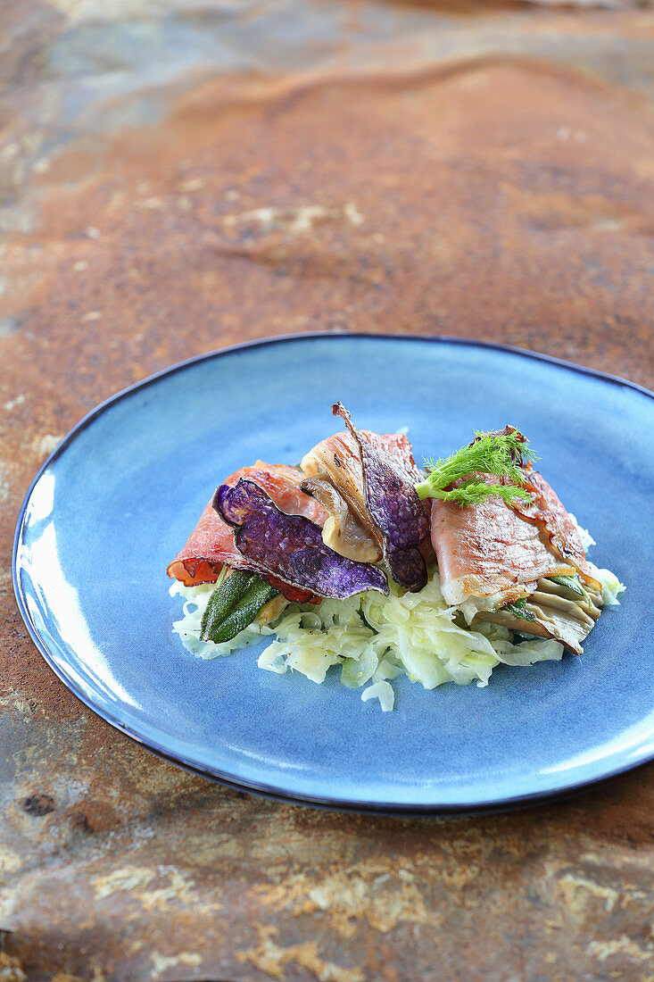 Mushroom saltimboca with fennel and purple potato crisps