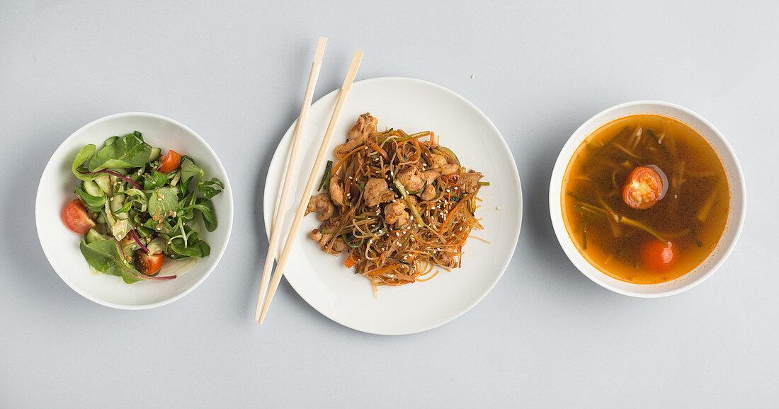 Vegetable salad, a noodle dish and miso soup (Japan)