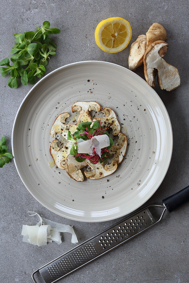 Porcini mushrooms carpaccio with lamb's lettuce and beetroot shoots