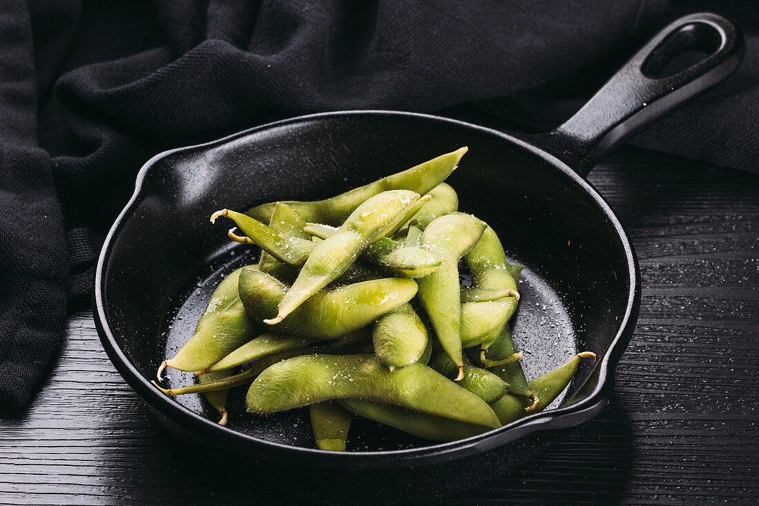 Edamame pods in a pan