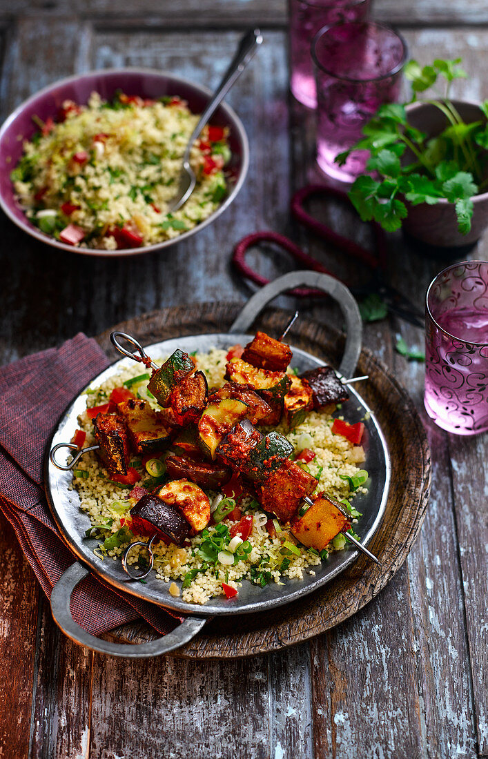 Spicy aubergine kebabs with harissa on couscous