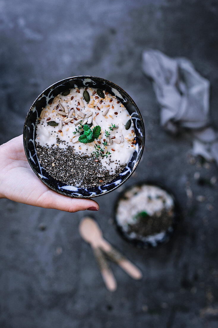 Bowl with healthy seeds and yogurt breakfast