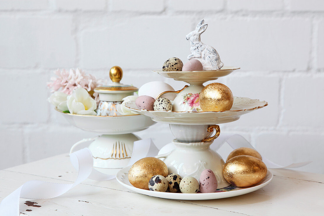 Easter eggs on cake stand made from vintage-style crockery