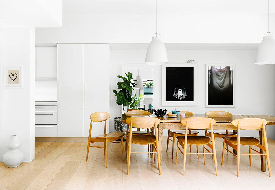 Dining area in a white, open living room