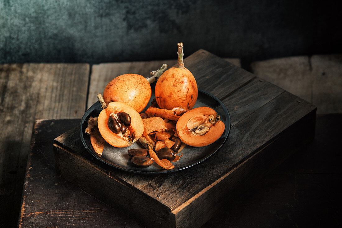 Fresh loquat fruit on rustic table