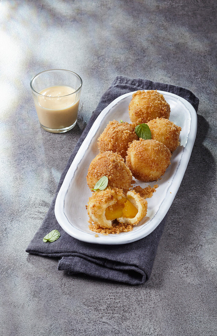 Apricot dumplings with cinnamon crumbs