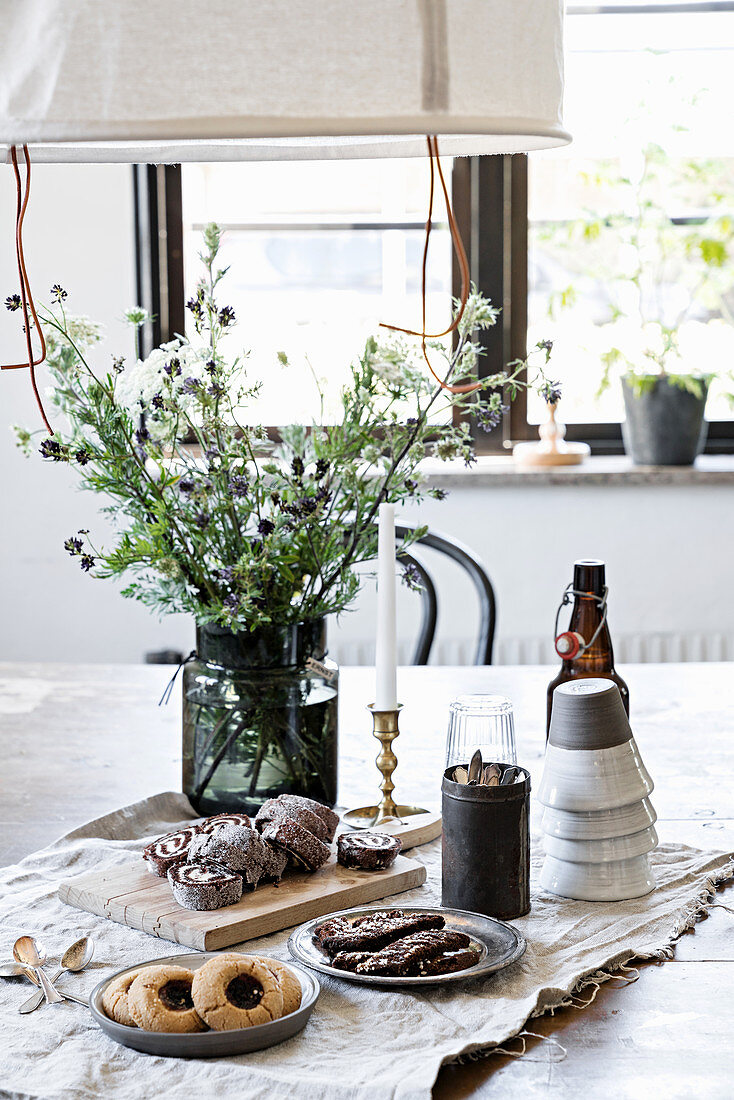 Table set with simple, rustic accessories and pastries