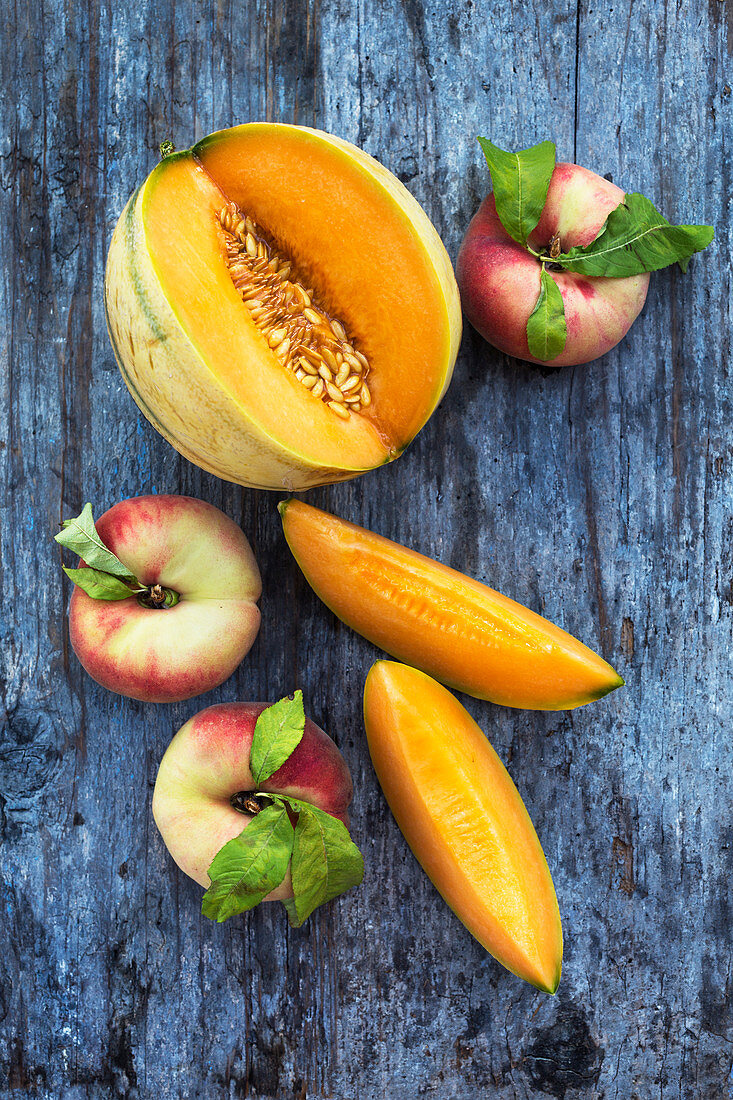 A still life with melon and peach