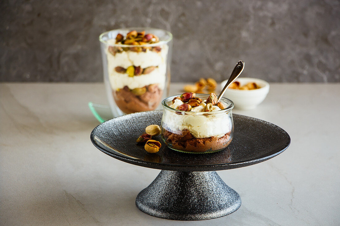 Mascarpone dessert in jar with green pistachio nuts