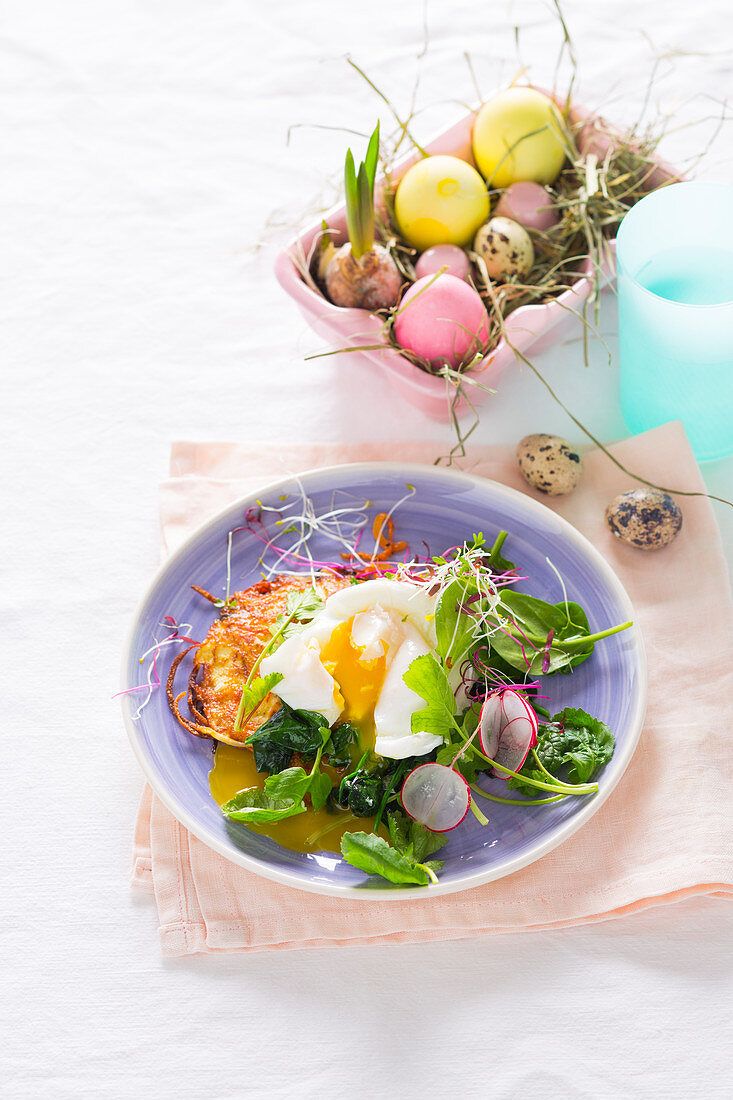 Hash browns with a spinach and radish medley and a poached egg