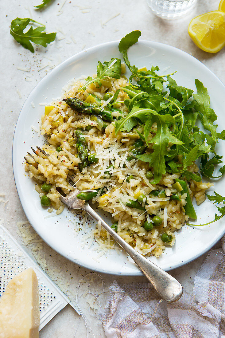 Risotto with peas, asparagus and rocket salad with parmesan