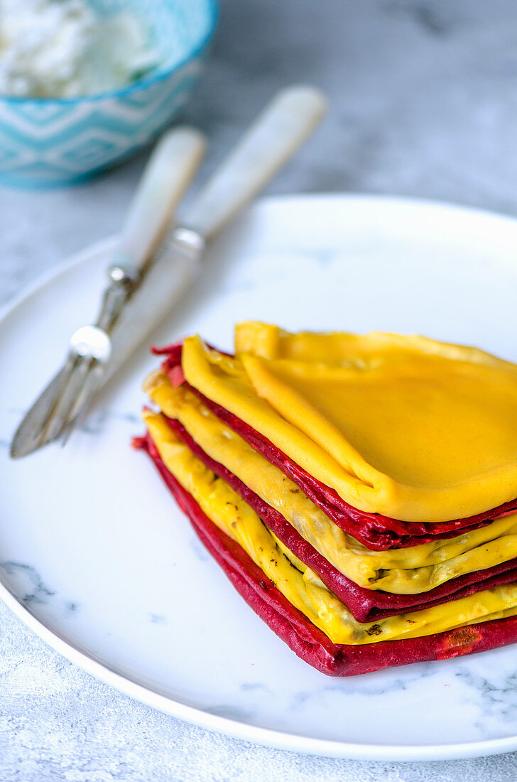 Thin pancakes with carrot and beet juice
