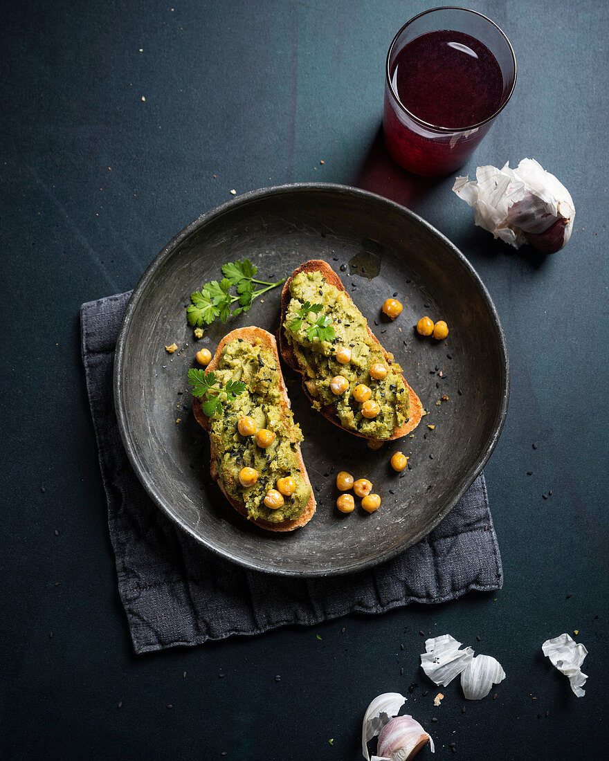 Grilled bread with a baked chickpea spread (vegan)