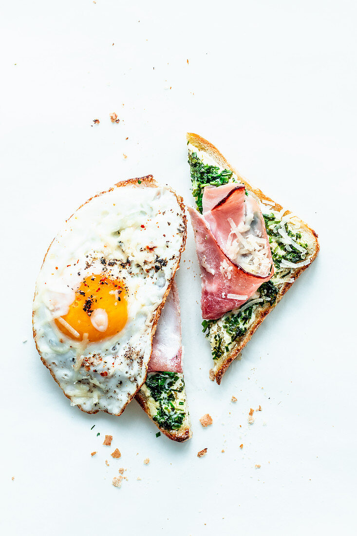 Toast with herbs, ham and a fried egg