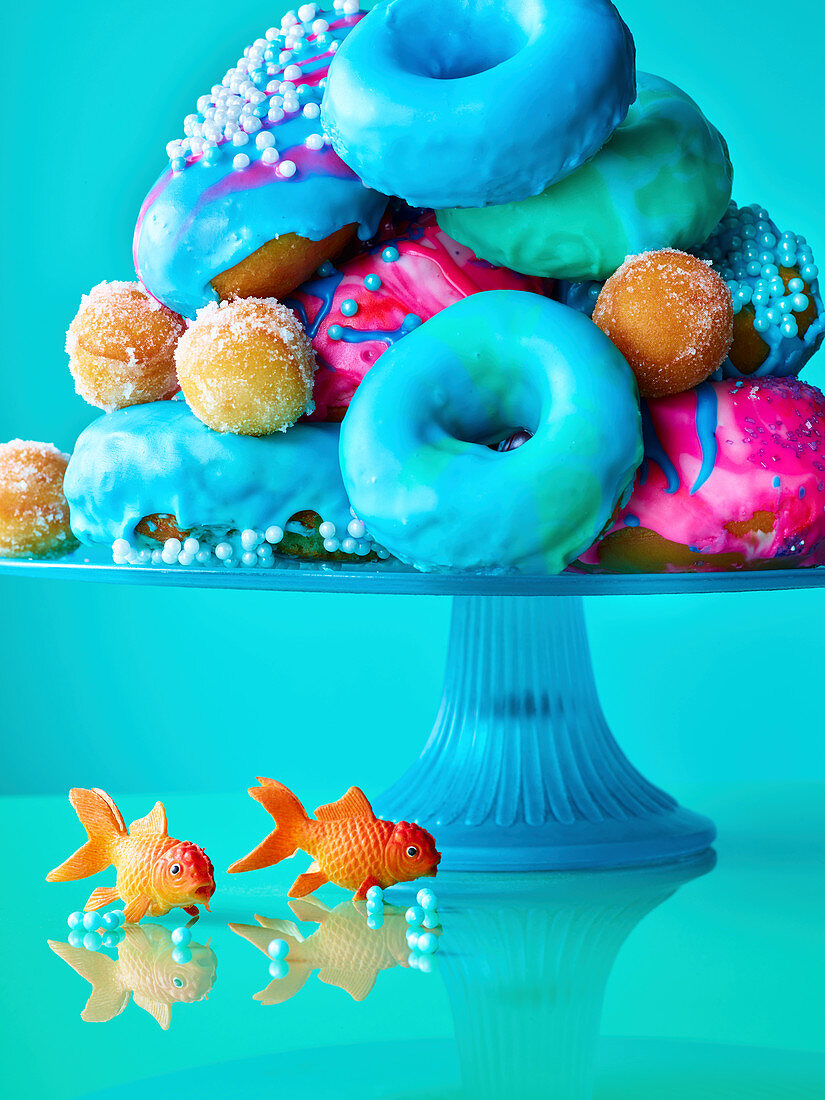 Colourful donuts on a cake stand