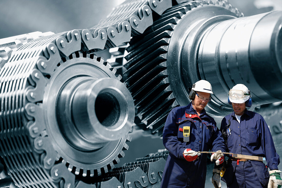 Industrial workers with metal cogs