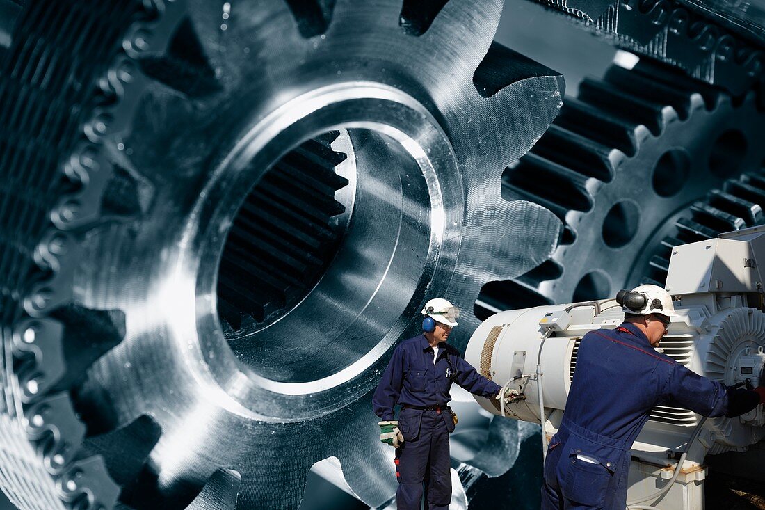 Industrial workers with metal cogs