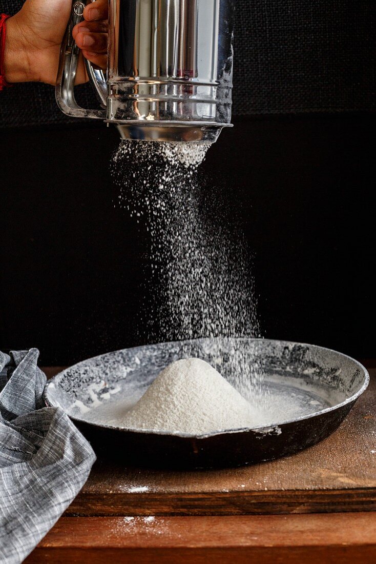 Flour being sieved