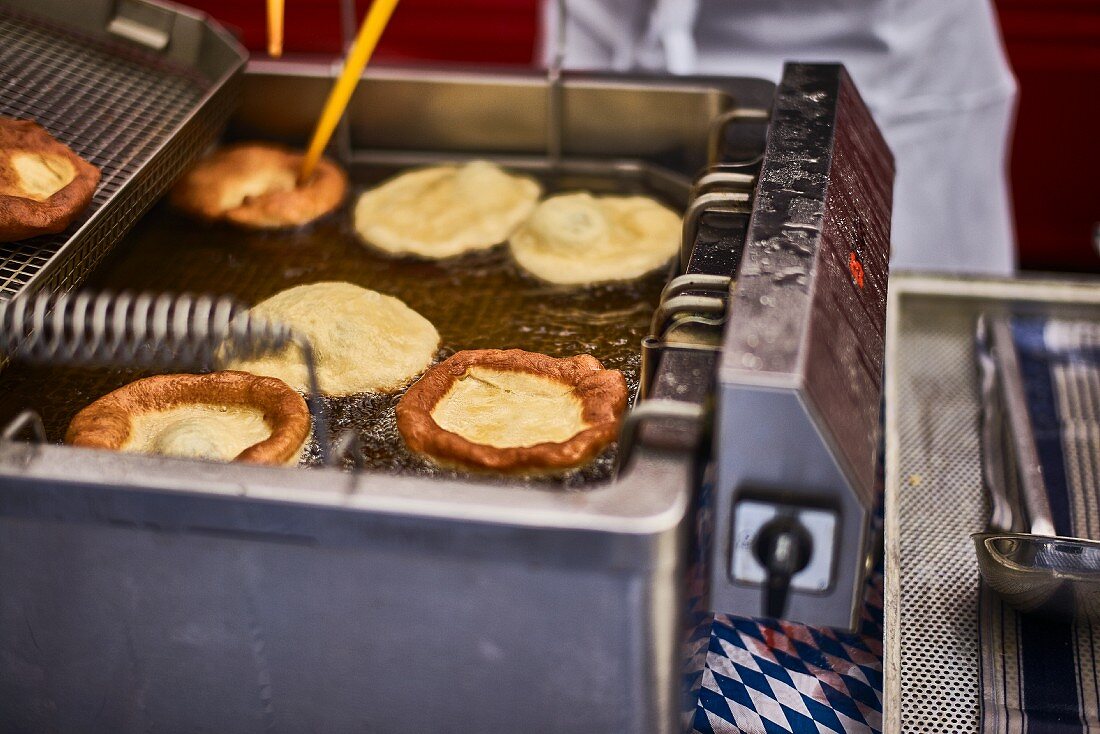 Bavarian doughnuts in a fryer