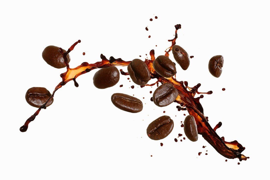 Coffee beans with a splash of coffee License Images 12262781 StockFood