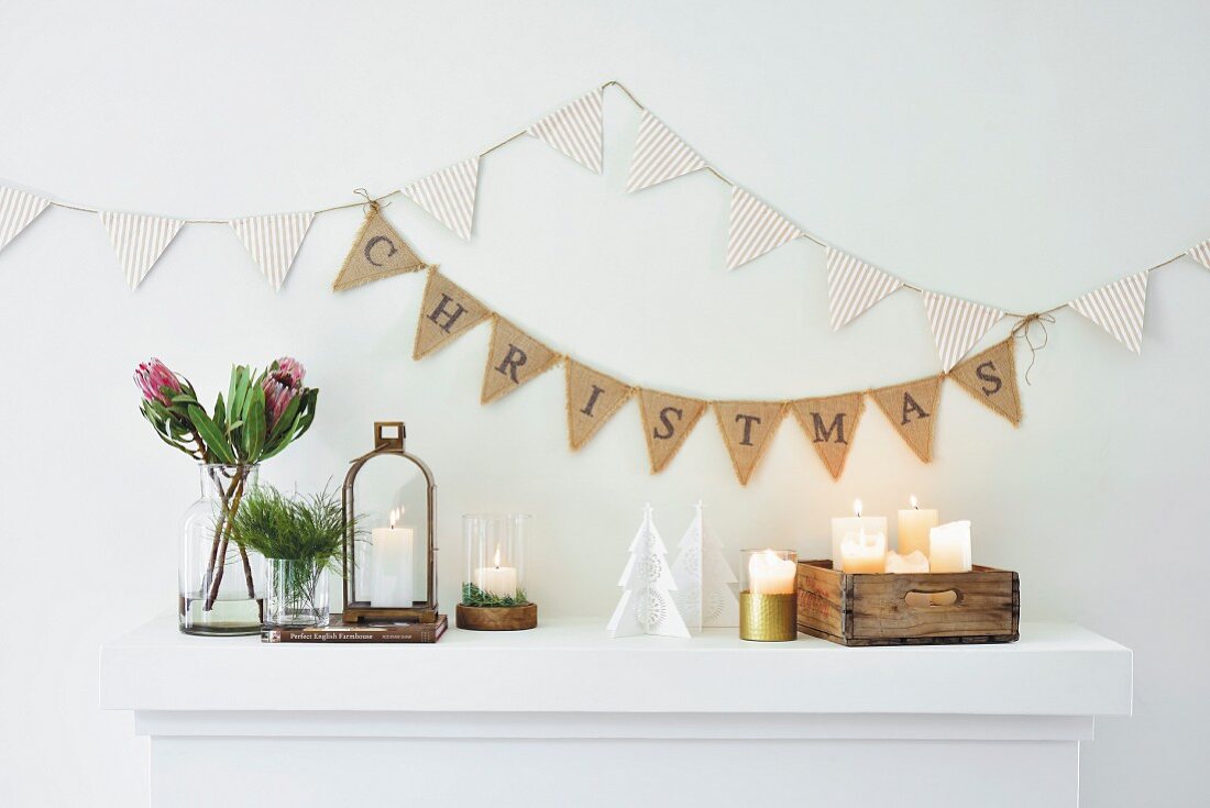 Striped and lettered bunting above arrangement of ornaments