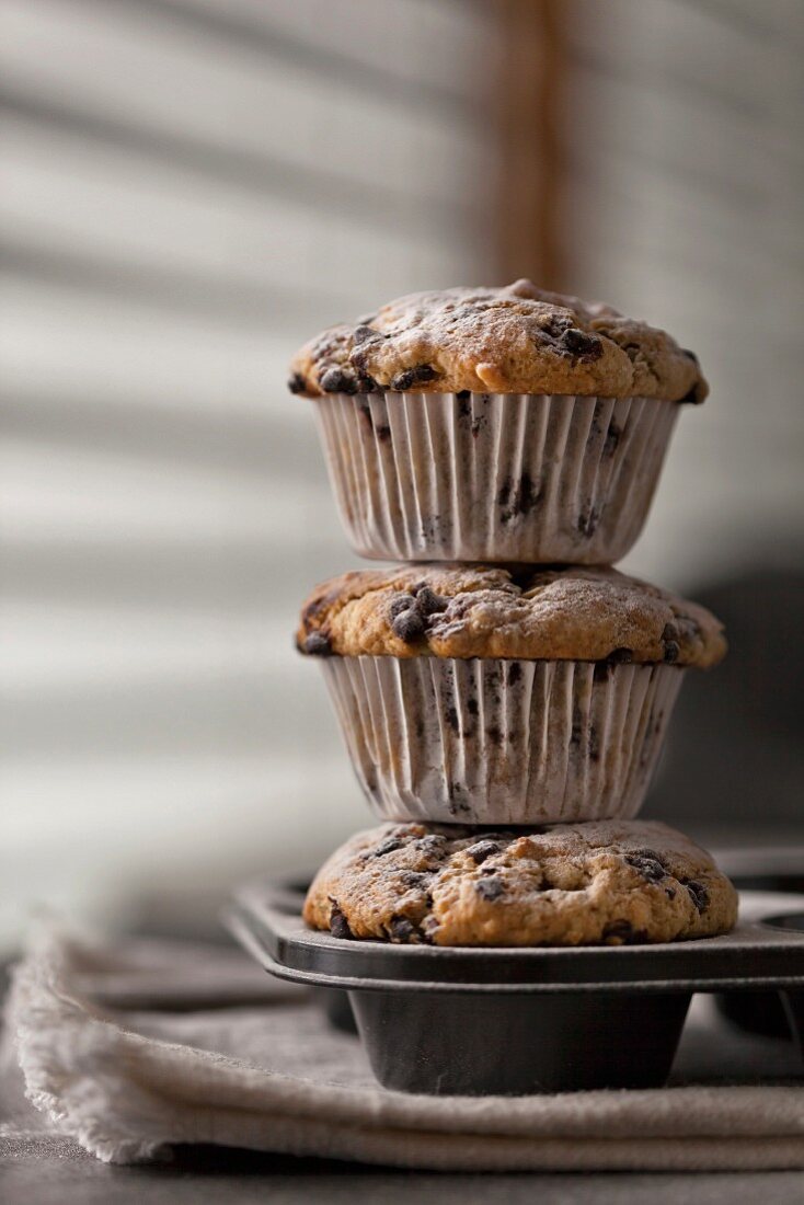 Stack of freshly baked banana chocolate chip muffins