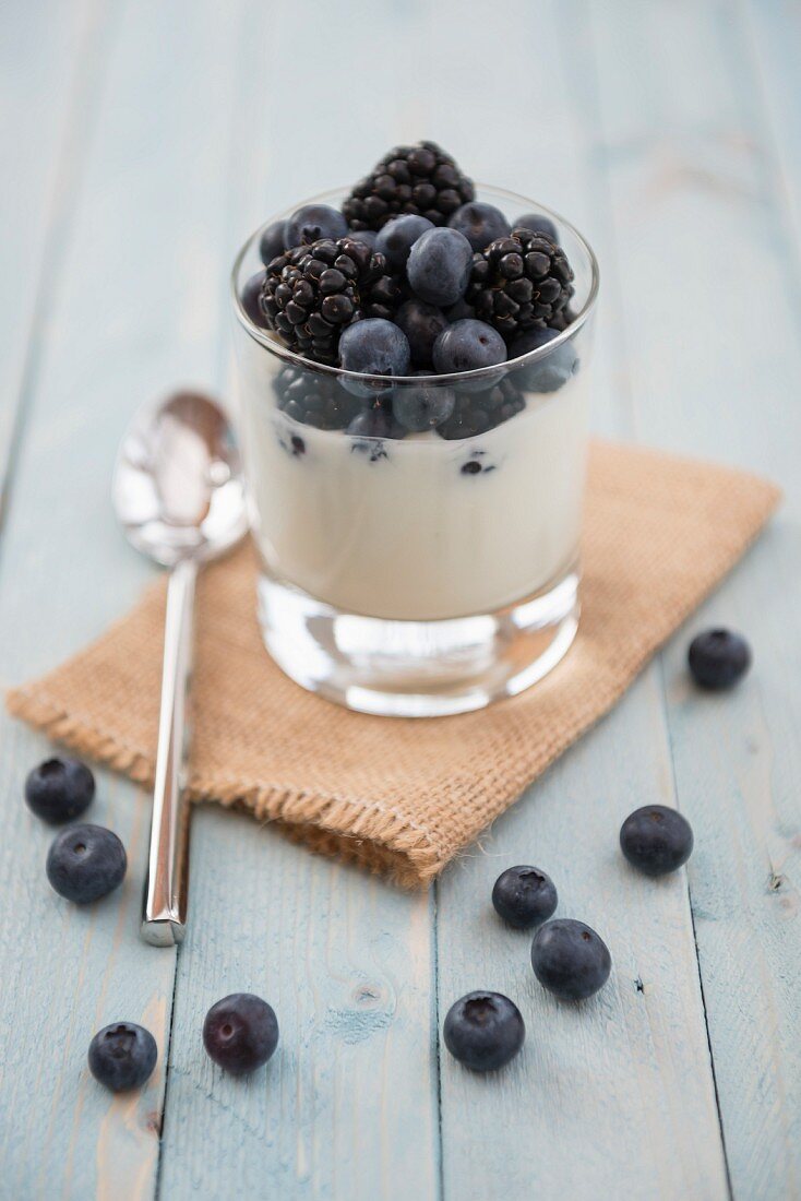 Blueberries and blackberries in natural yoghurt