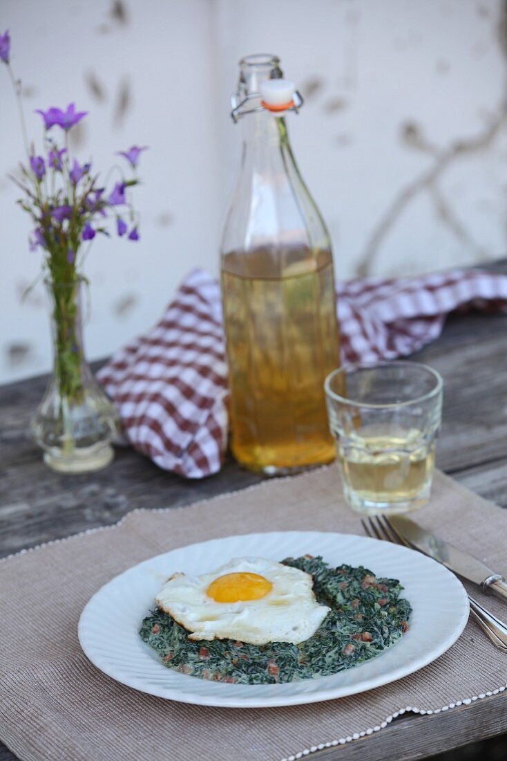 Stinging nettles with bacon and fried egg