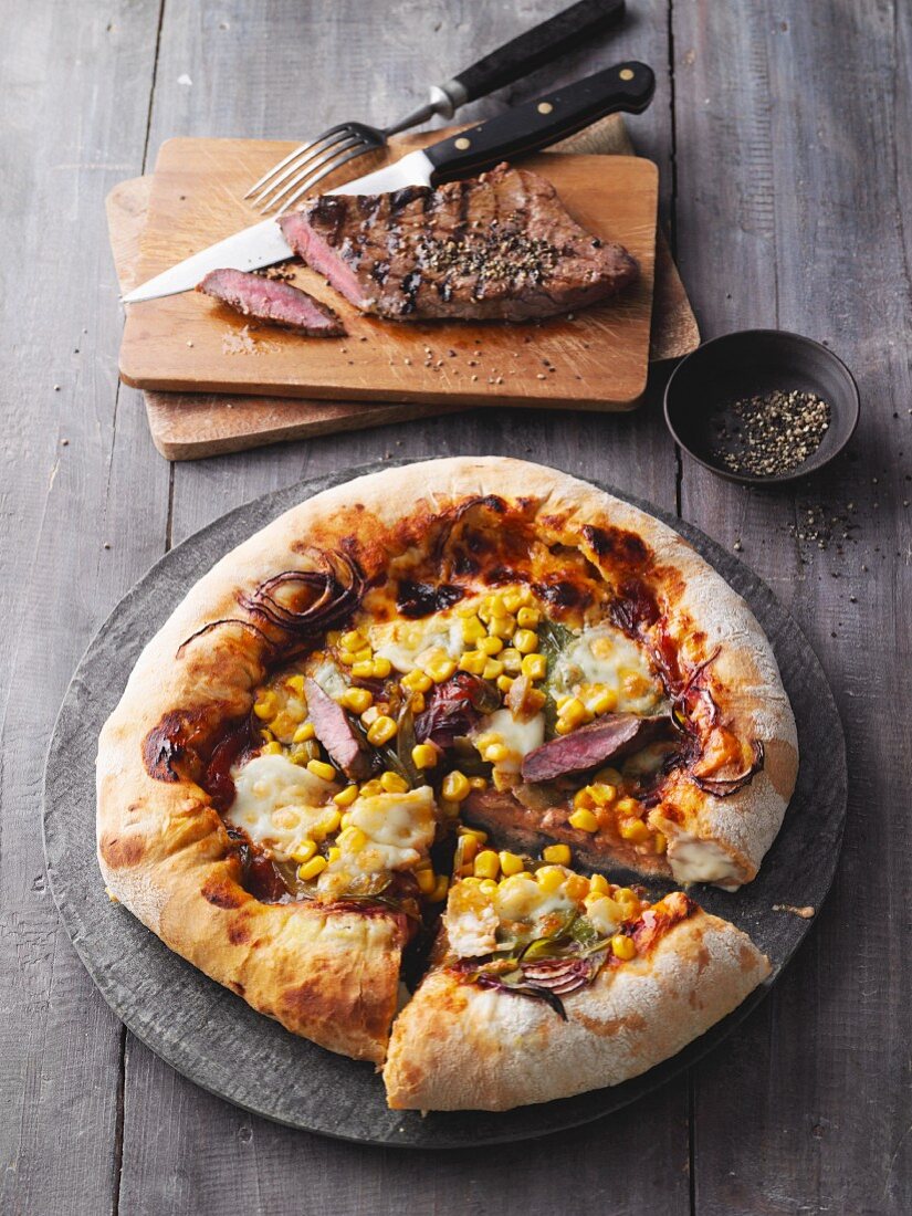 American pizza with sweetcorn, beef and BBQ sauce