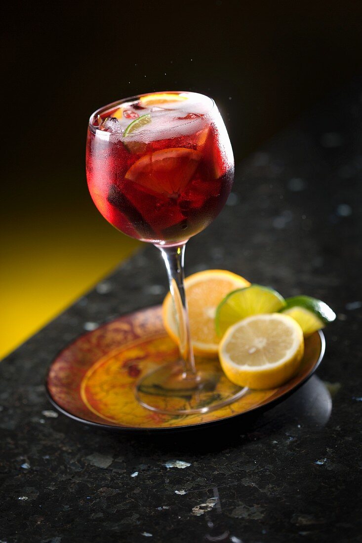 Sangria in a glass with citrus fruits