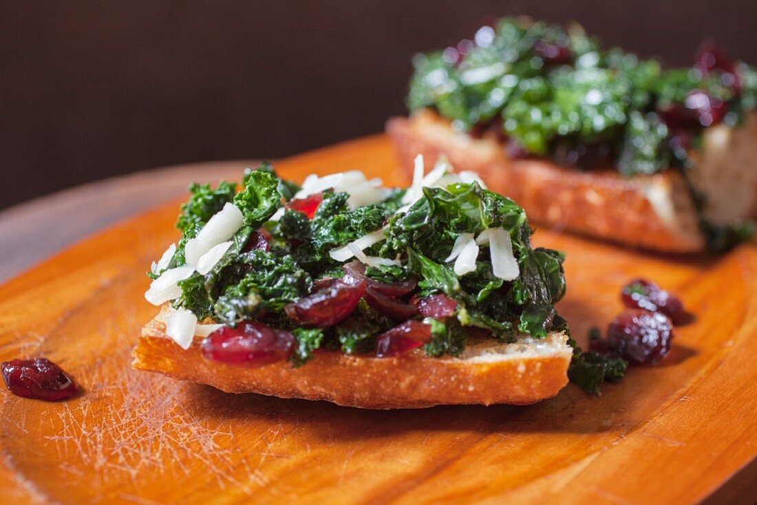 Toasted Bread with Kale, Cranberries and Shredded Cheese Waiting for Poached Egg