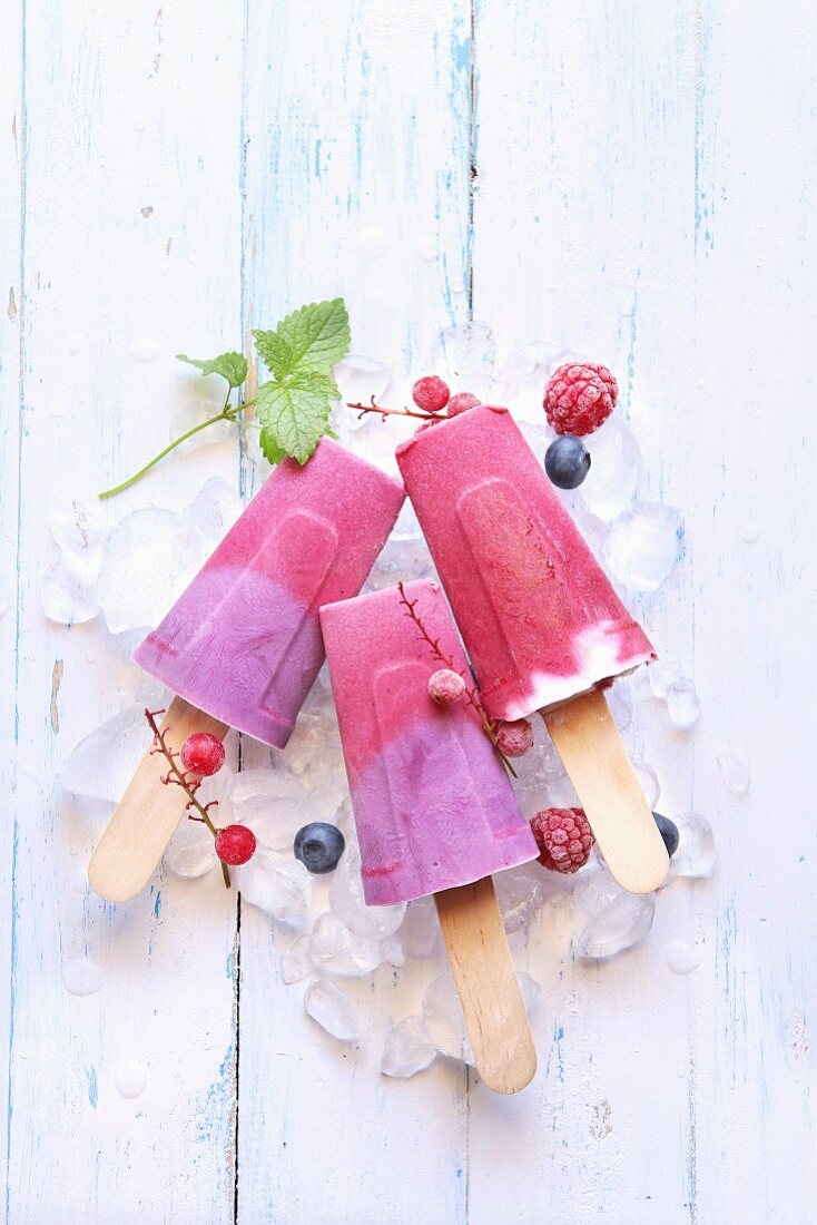 Summer ice cream popsicles with blueberry, raspberry and yogurt