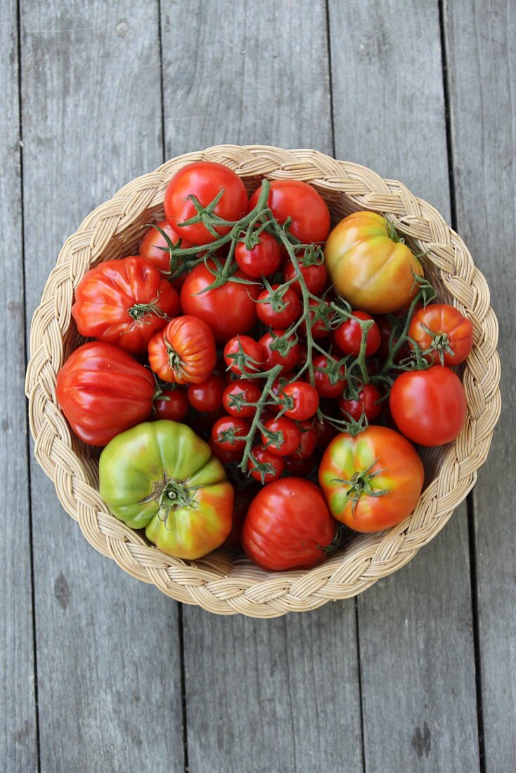 Various types of tomatoes in a basket