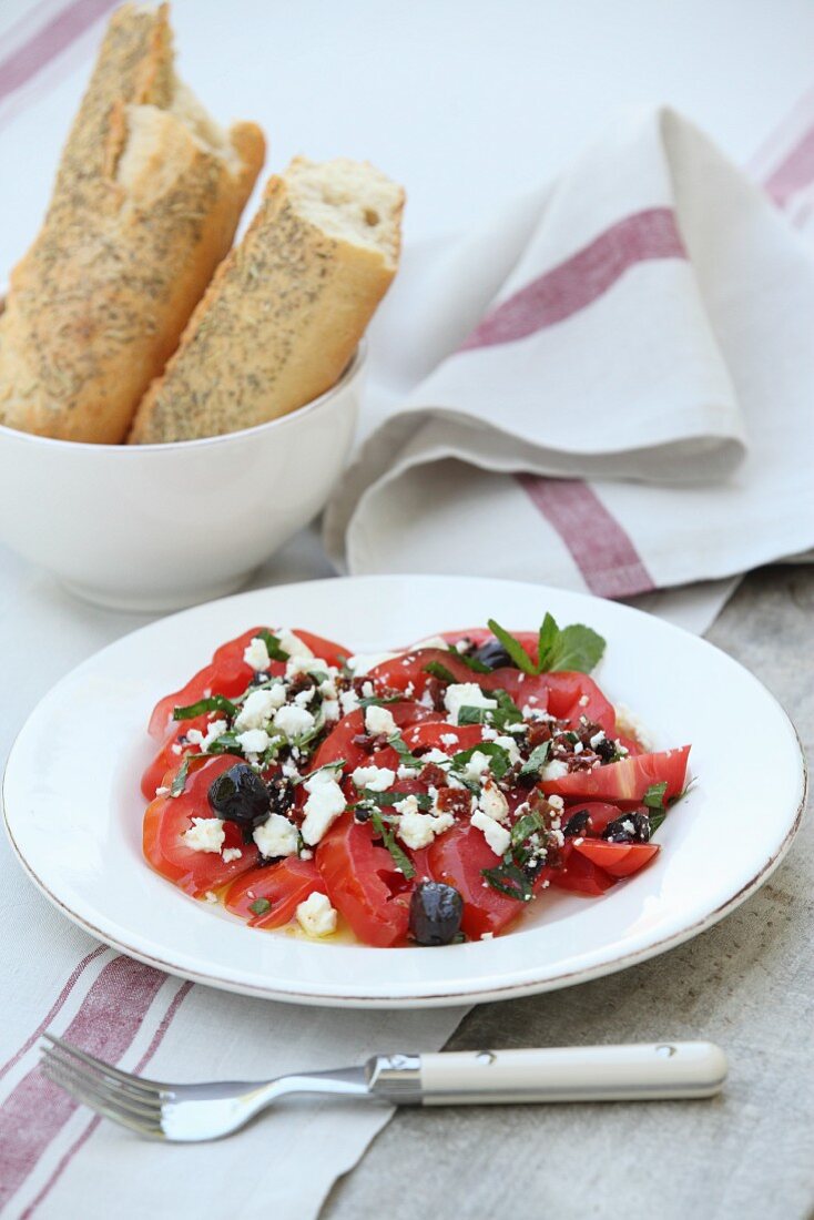 Beefsteak tomatoes with sheep's cheese and olives