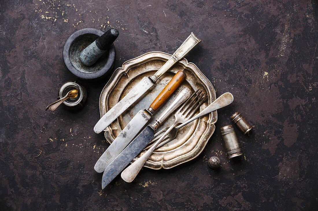 Vintage Kitchenware Table Knives and Forks on black background