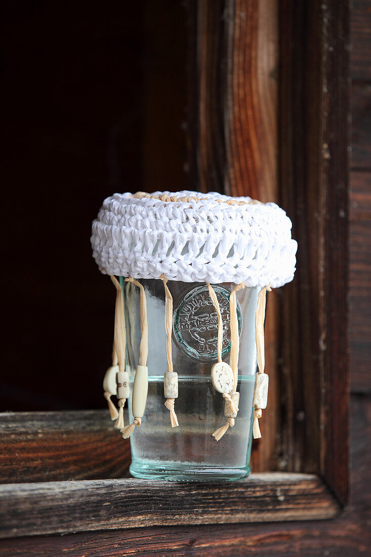 Crocheted raffia jam jar lid