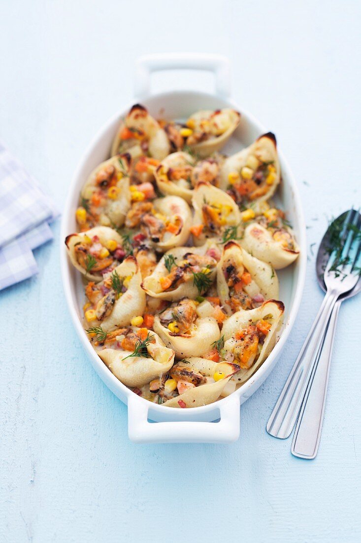 Conchiglie stuffed with seafood and vegetables