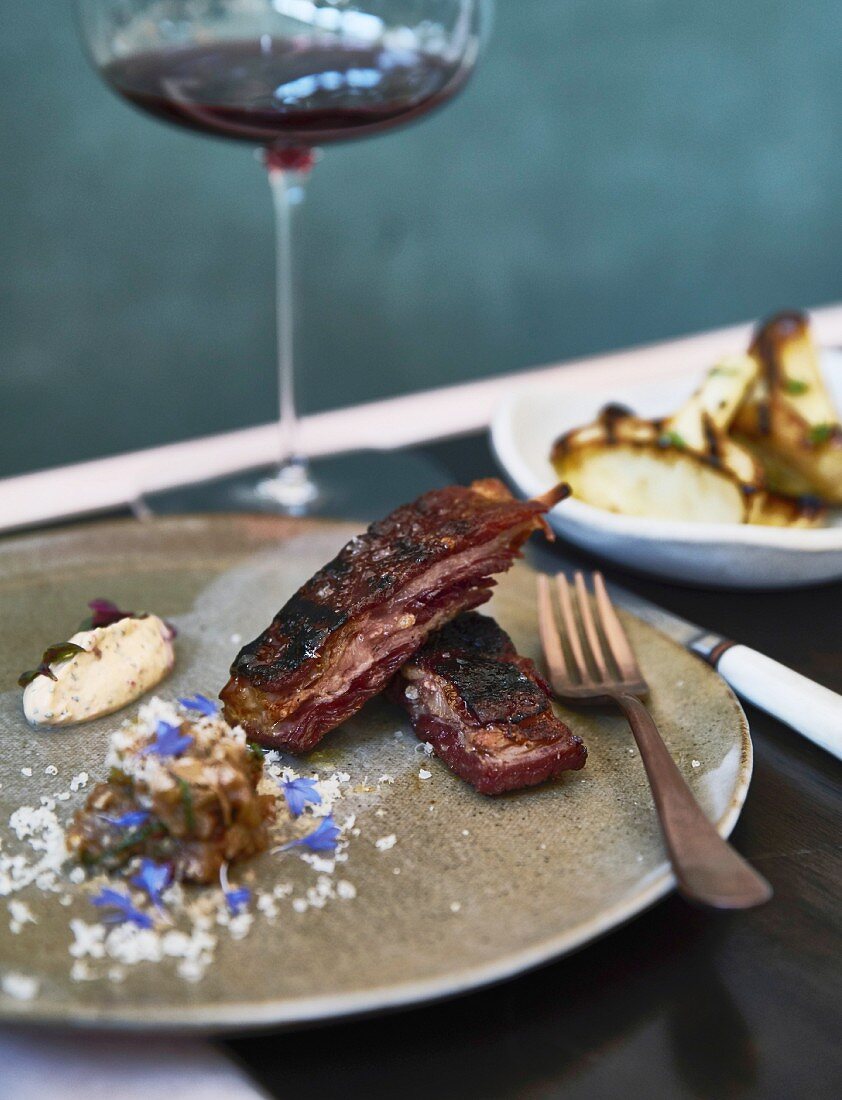 Grilled lamb ribs with smoked aubergine and yoghurt sauce
