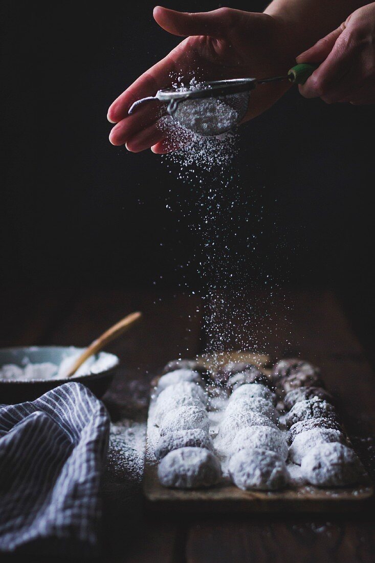 Cocoa polvorones (snowballs) covered in icing sugar
