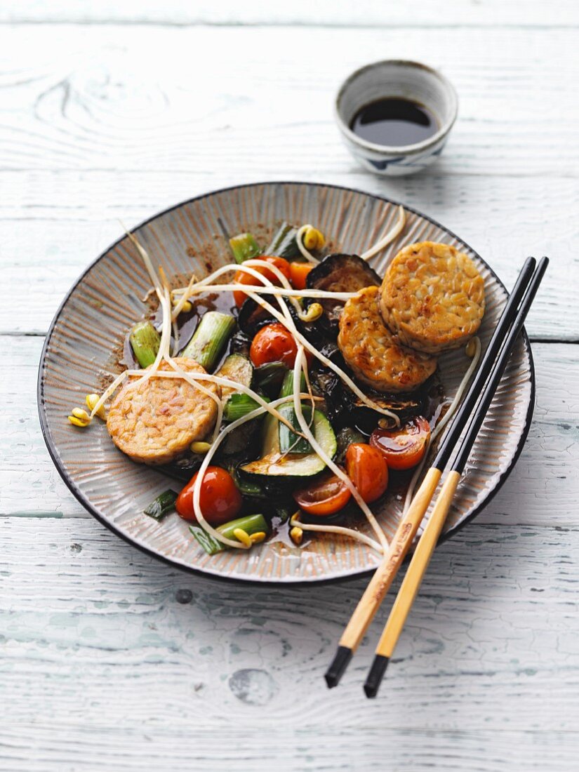 Courgette vegetable dish with shoots and tempeh