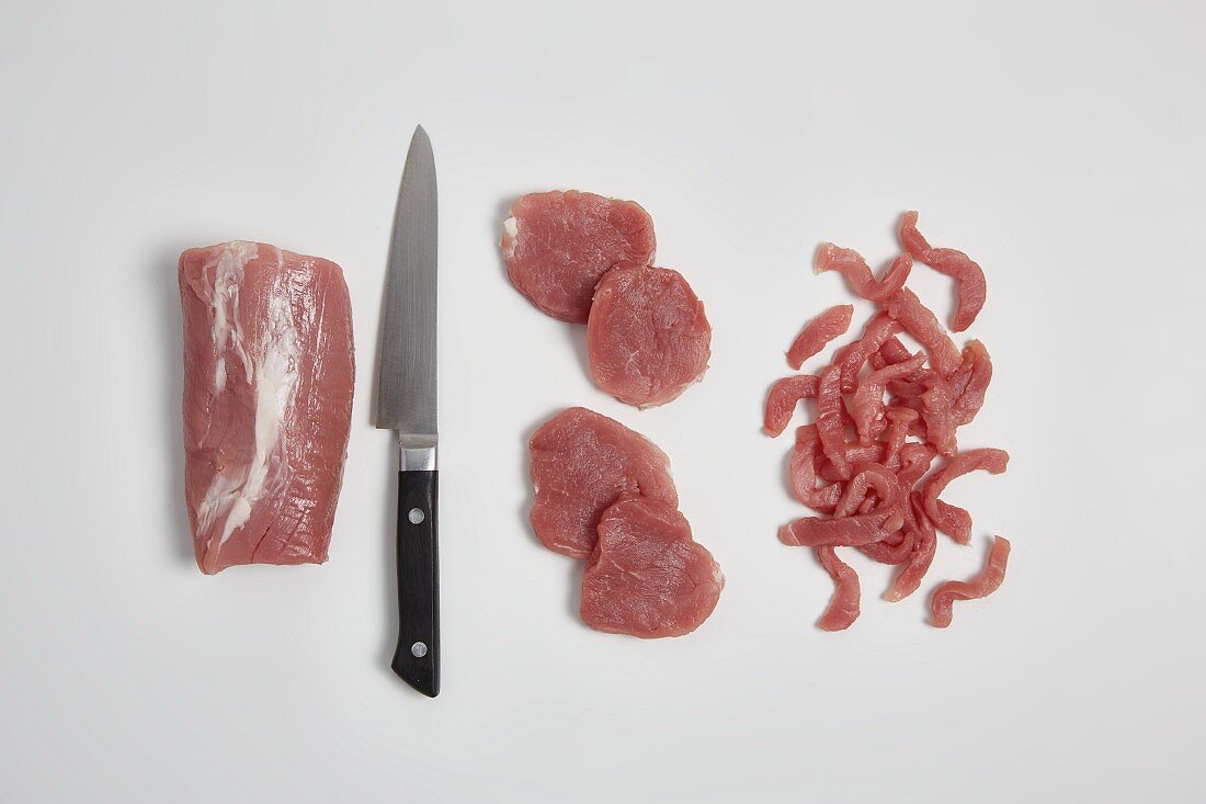 Veal being cut into slices and strips (step by step)