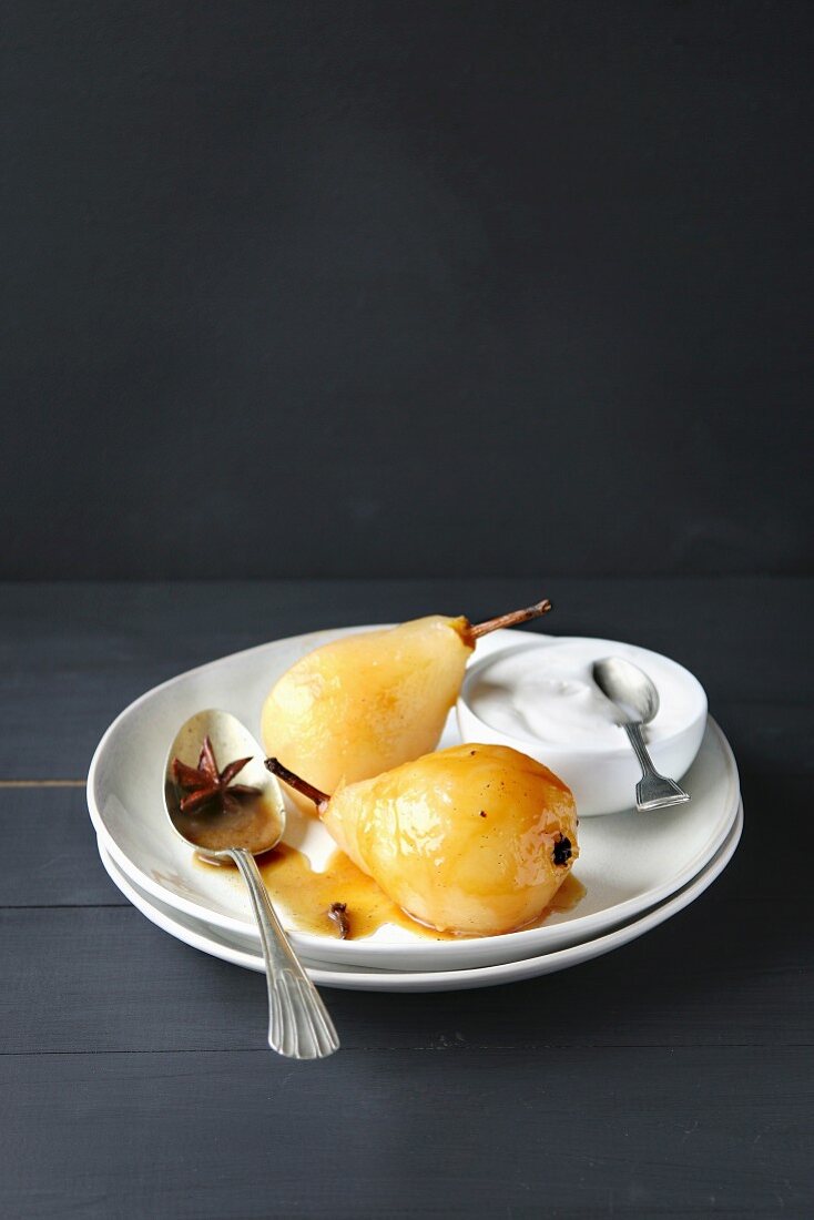 Poached pears with caramel sauce and whipped cream