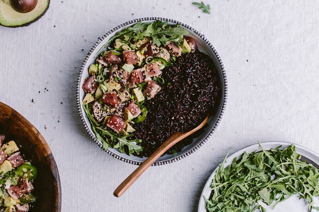 A bowl of Sesame Crusted Seared Tuna Salad and forbidden rice bowl