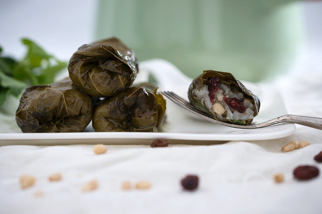 Vine leaves stuffed with rice, pine nuts and cranberries (vegan)