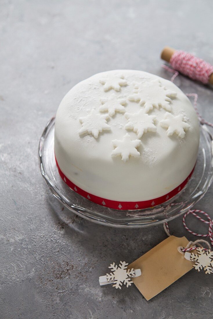 Boiled festive fruit cake with white icing on the top