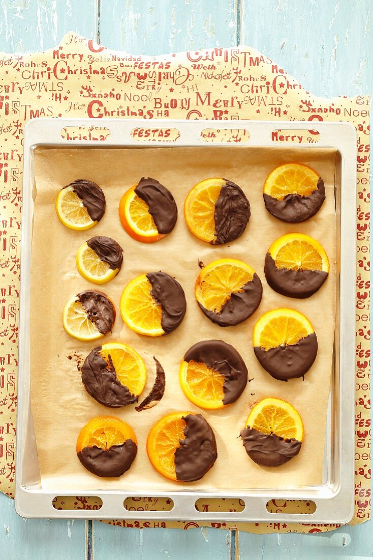 Candied orange and lemon slices with dark chocolate glazing