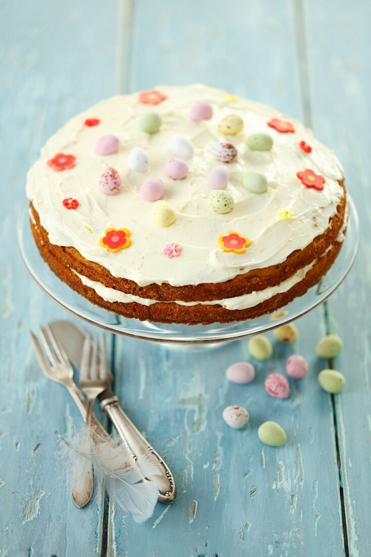 Carrot cake with orange cream and chocolate eggs