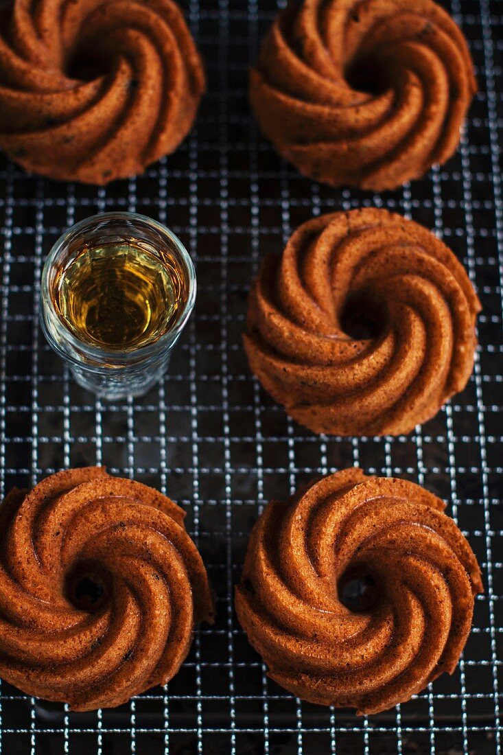 Bourbon and peanut mini cakes cooling on a wire rack