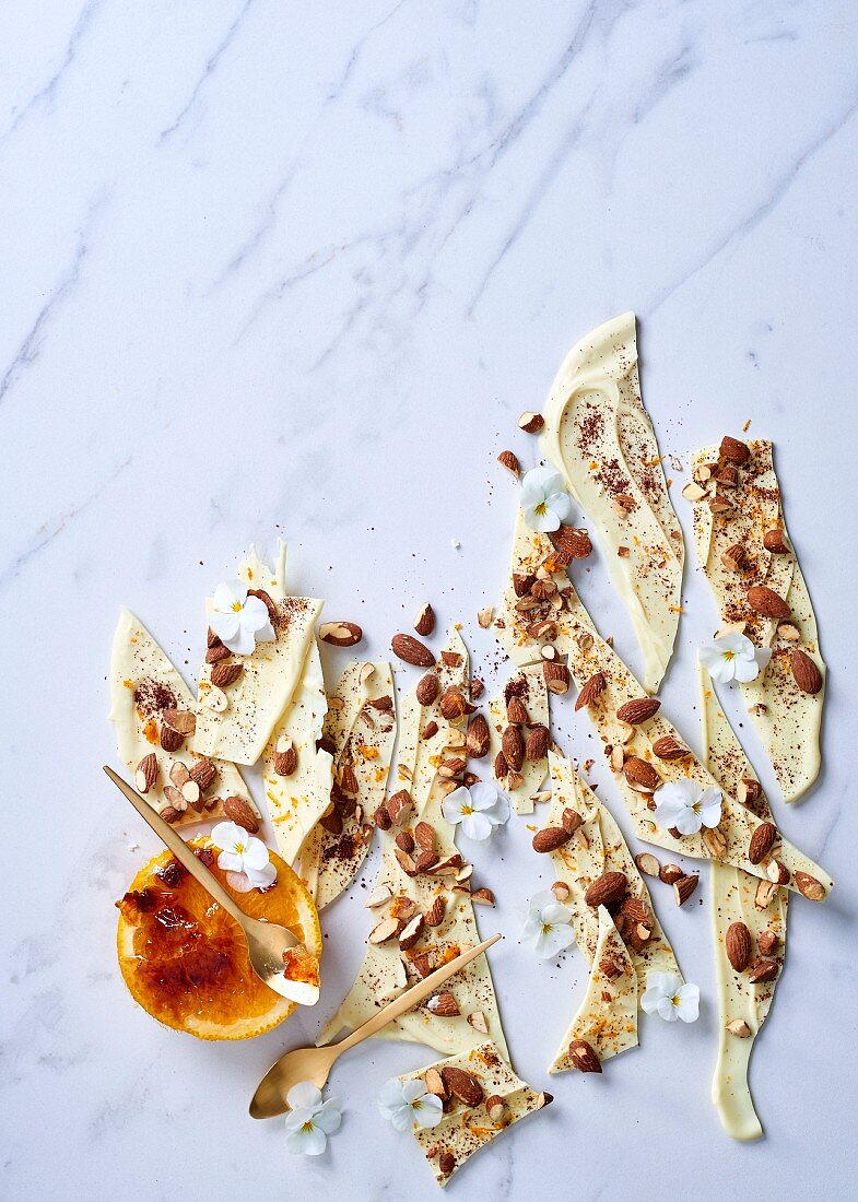 White chocolate with salted almonds, sumac and orange