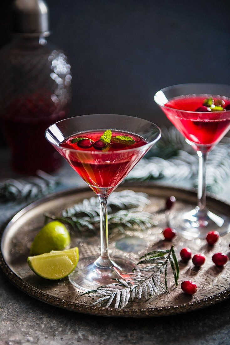 A cranberry cocktail with lime and mint for Christmas